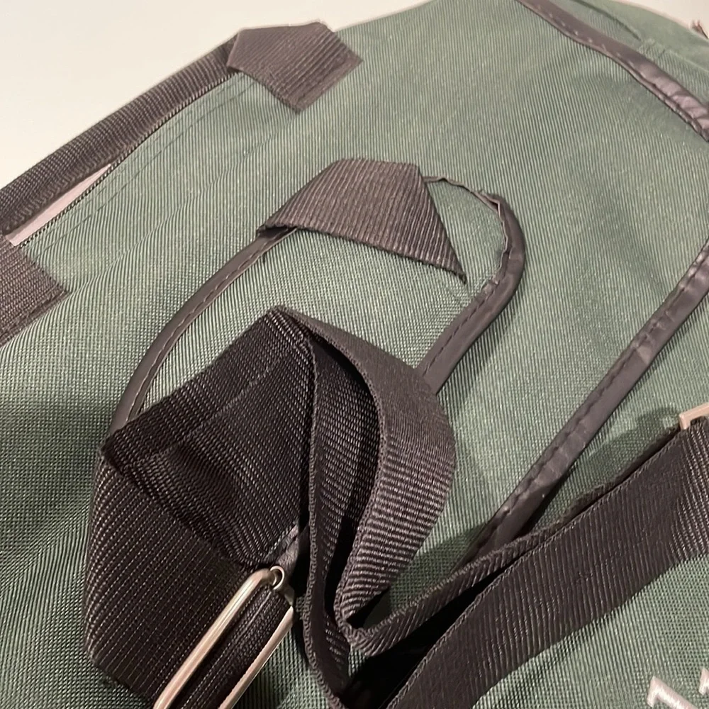Dark green canvas briefcase with laptop sleeve and multiple pockets. NWT